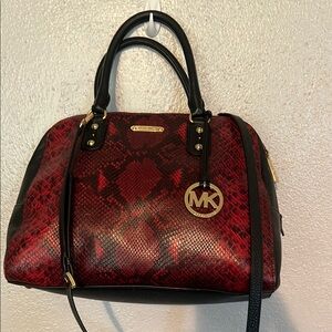 This Michael Michael Kors snake has never been carried